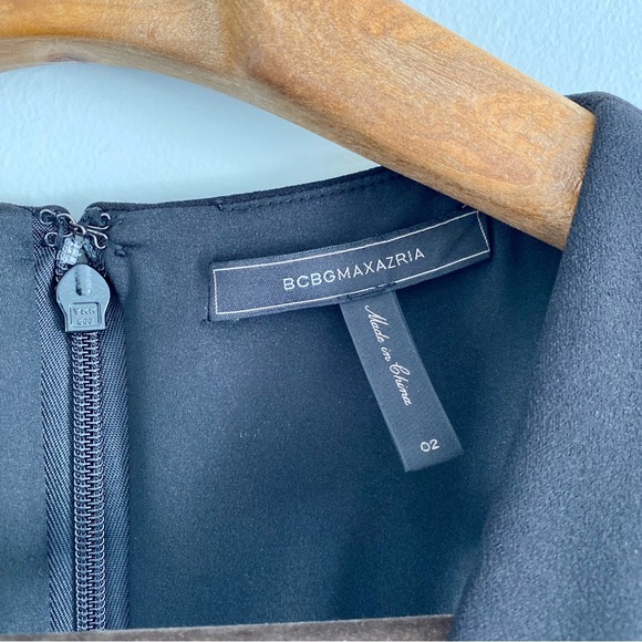 BCBG MaxAzria Elegant Black Deep V-Neckline Sleeveless Peplum Dress - Picture 3 of 8